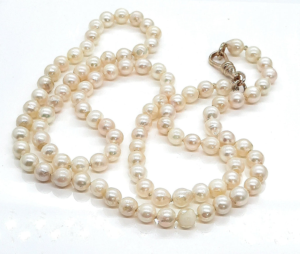 Strand of 99 Cultured Pearls with a Yellow Gold Albert Swivel Clasp